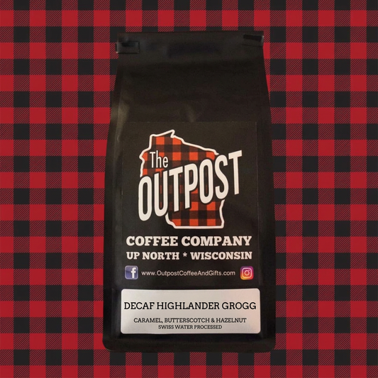 Decaf Highlander Grogg coffee bag on red and black plaid, caramel, butterscotch and hazelnut